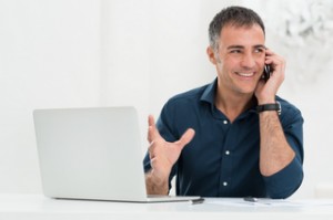 Smiling Man Talking On Cellphone